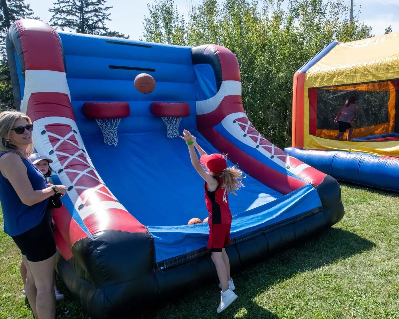 Inflatable family play areas on the grass during the 2025 festival