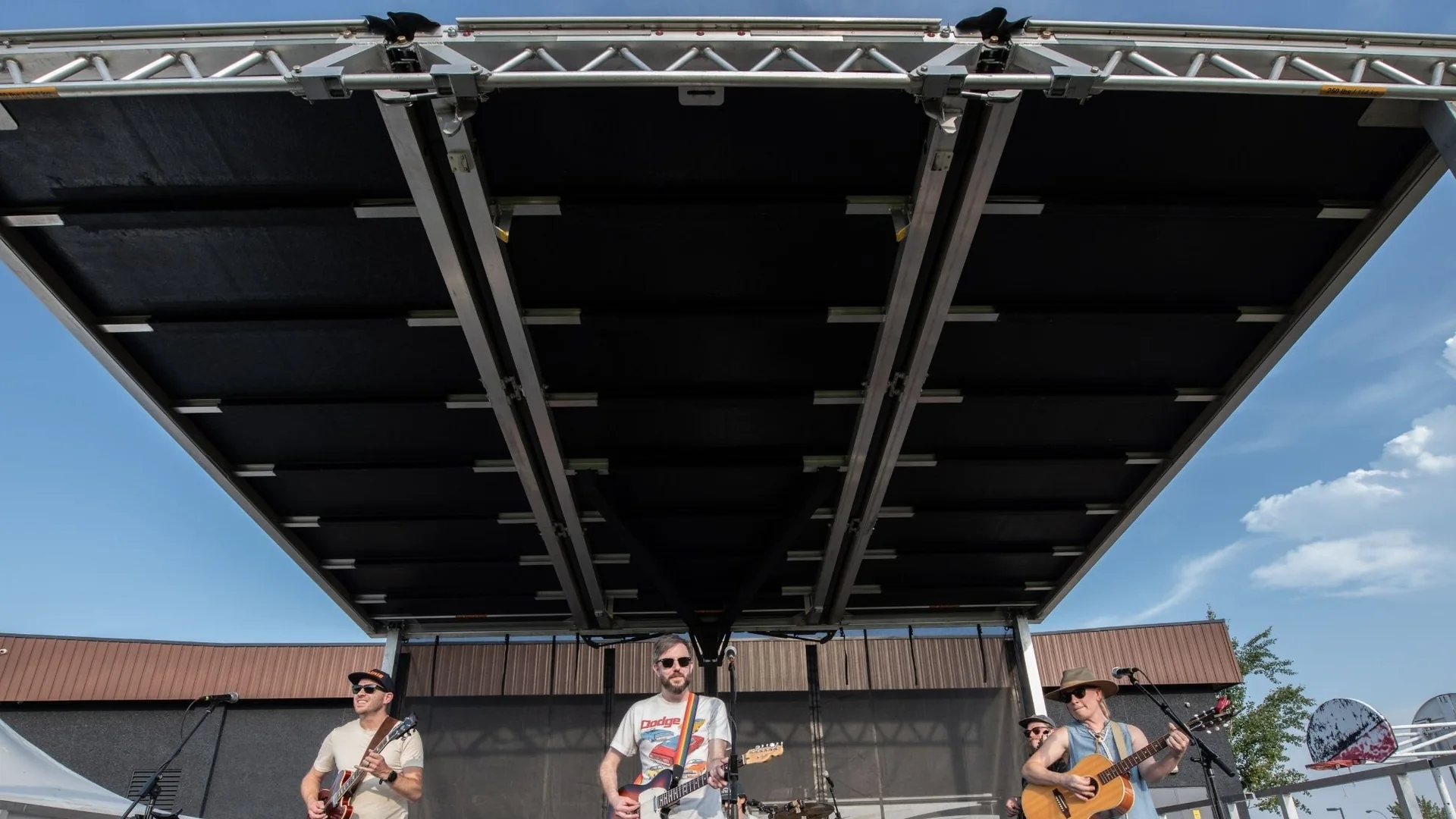 A band performing beneath the outdoor stage canopy at the inaugural festival in 2025